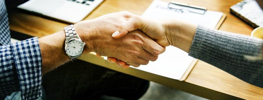 handshake with person wearing watch